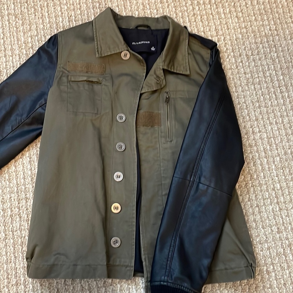 Green bomber jacket with fake leather sleeves.